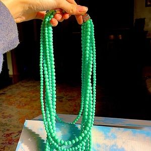 A turquoise and gold necklace